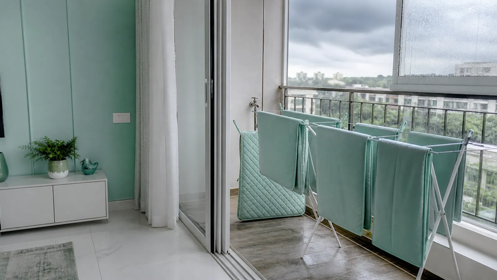 Removable cushion covers drying in a ventilated Mumbai utility balcony