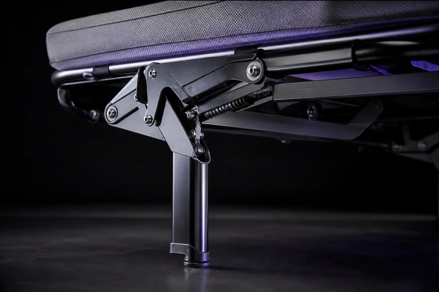 Close view of a sofa bed pull-out mechanism and support leg