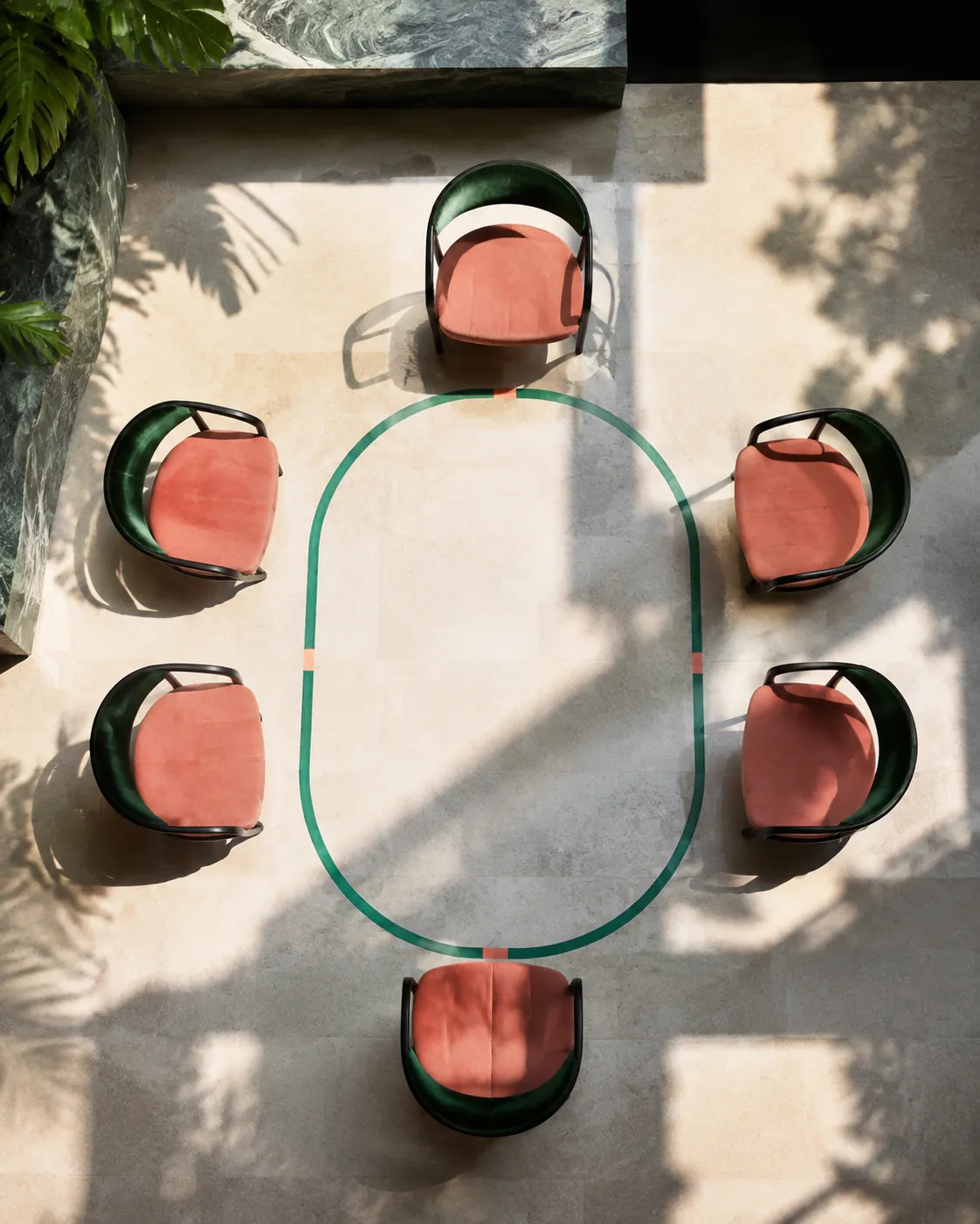 Dining table and six chair footprints marked on a stone floor