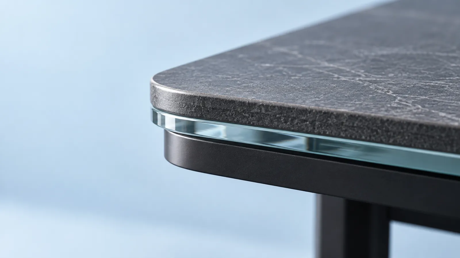 Conceptual close view of a layered ceramic-look tabletop edge and its support