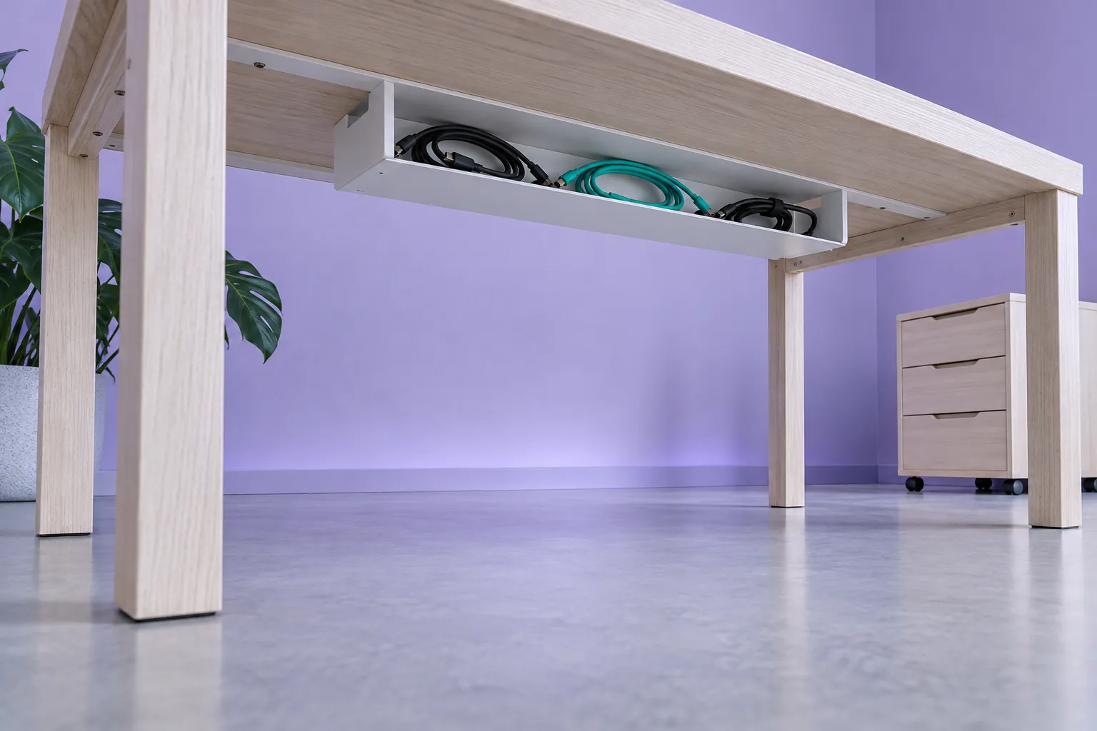 Illustrative under-desk cable tray and clear access space, not an electrical installation guide
