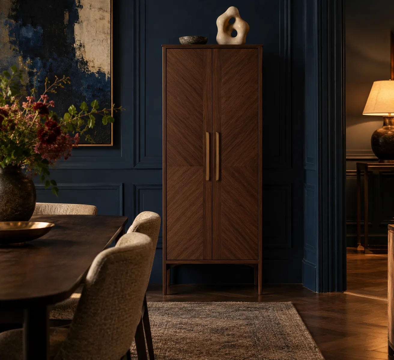 Closed walnut drinks cabinet against a midnight blue wall