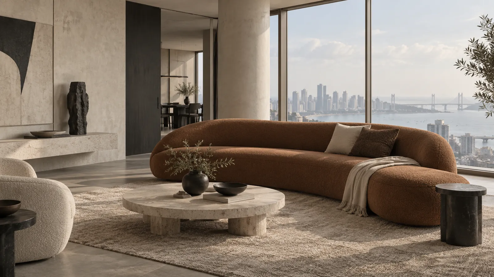 Sculptural cinnamon custom sofa in a neutral Mumbai apartment